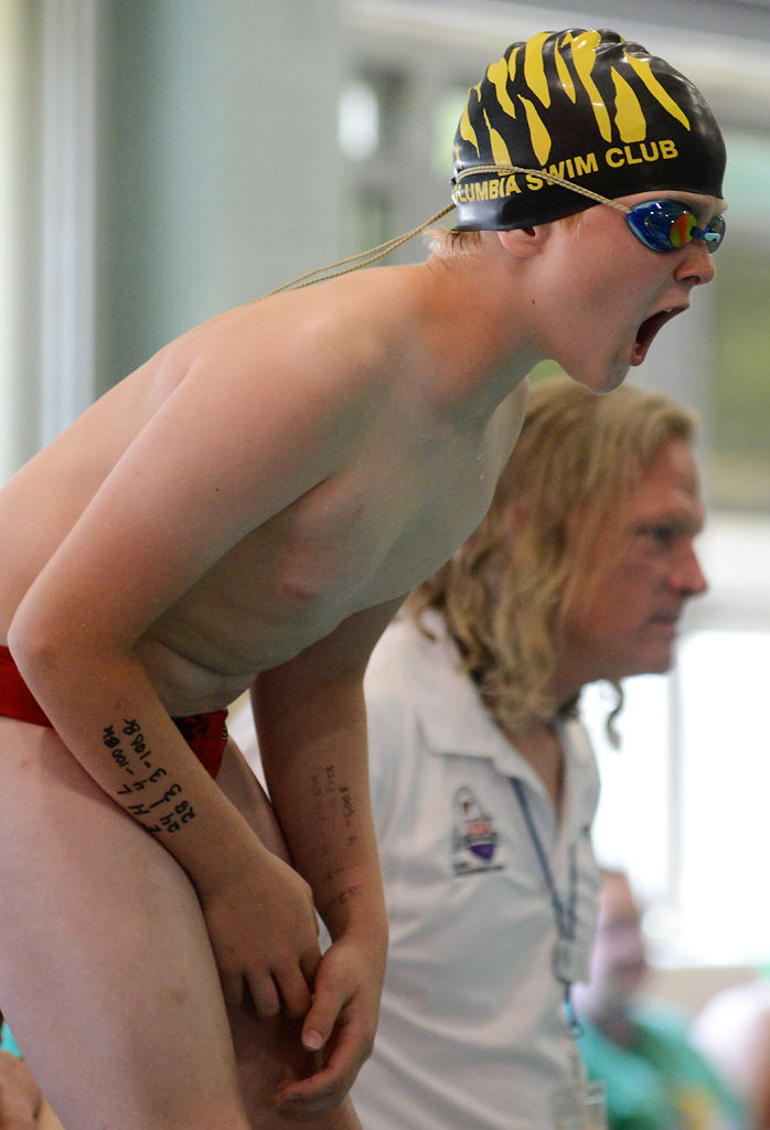 Tobias White, 10, cheers on his fellow teammates during the mixed 200-yard medley relay